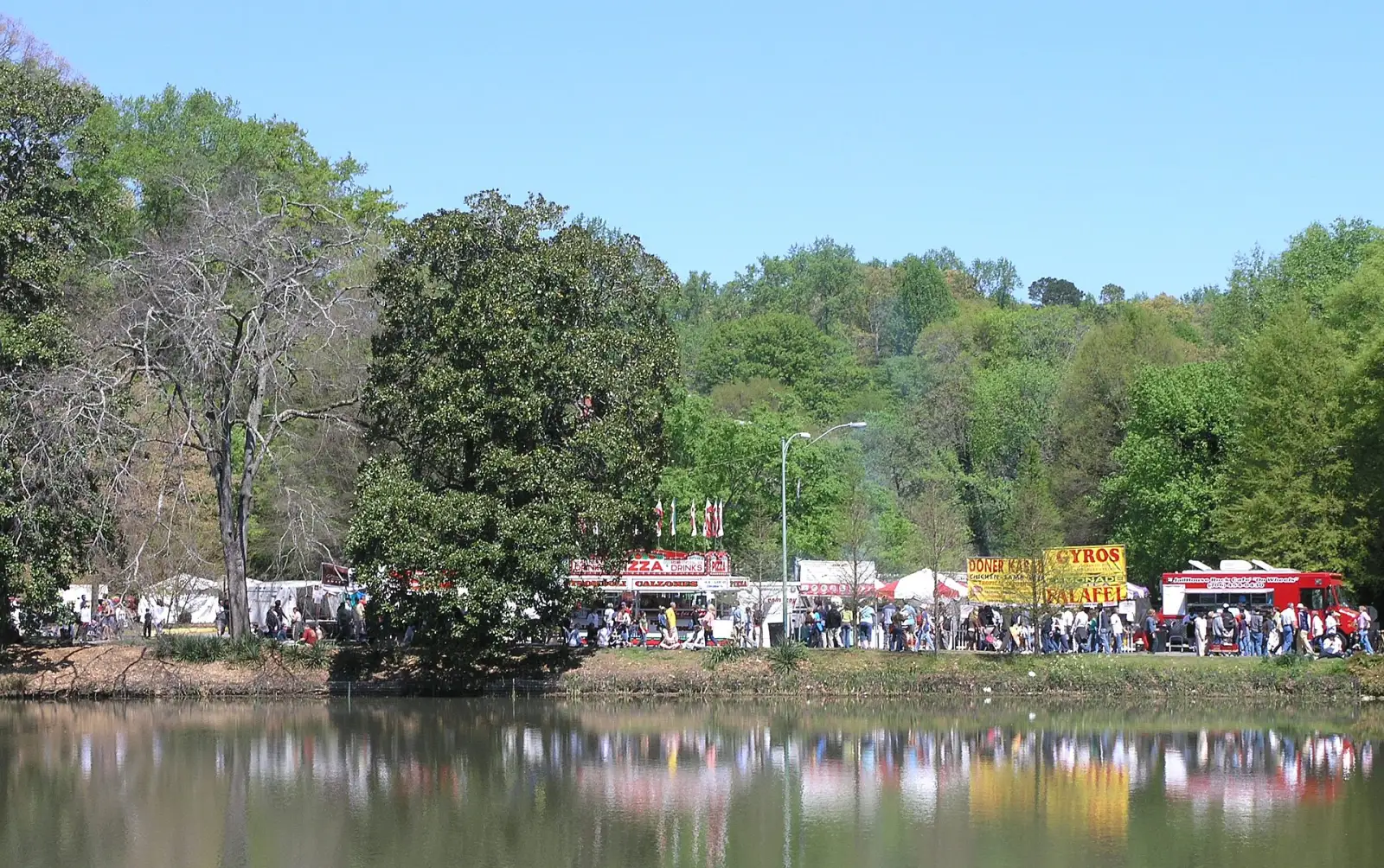 Food stands at the Atlanta Dogwood Festival on the shore of Lake Clara Meer in Piedmont Park.