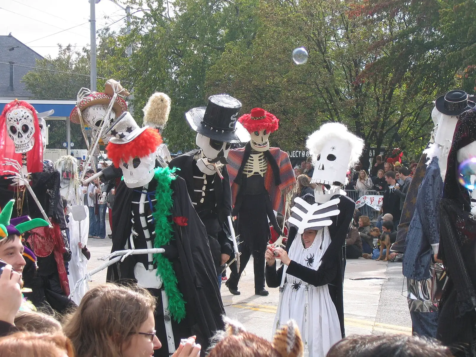 Giant skeleton puppets march in the Little Five Points Halloween parade in Atlanta.
