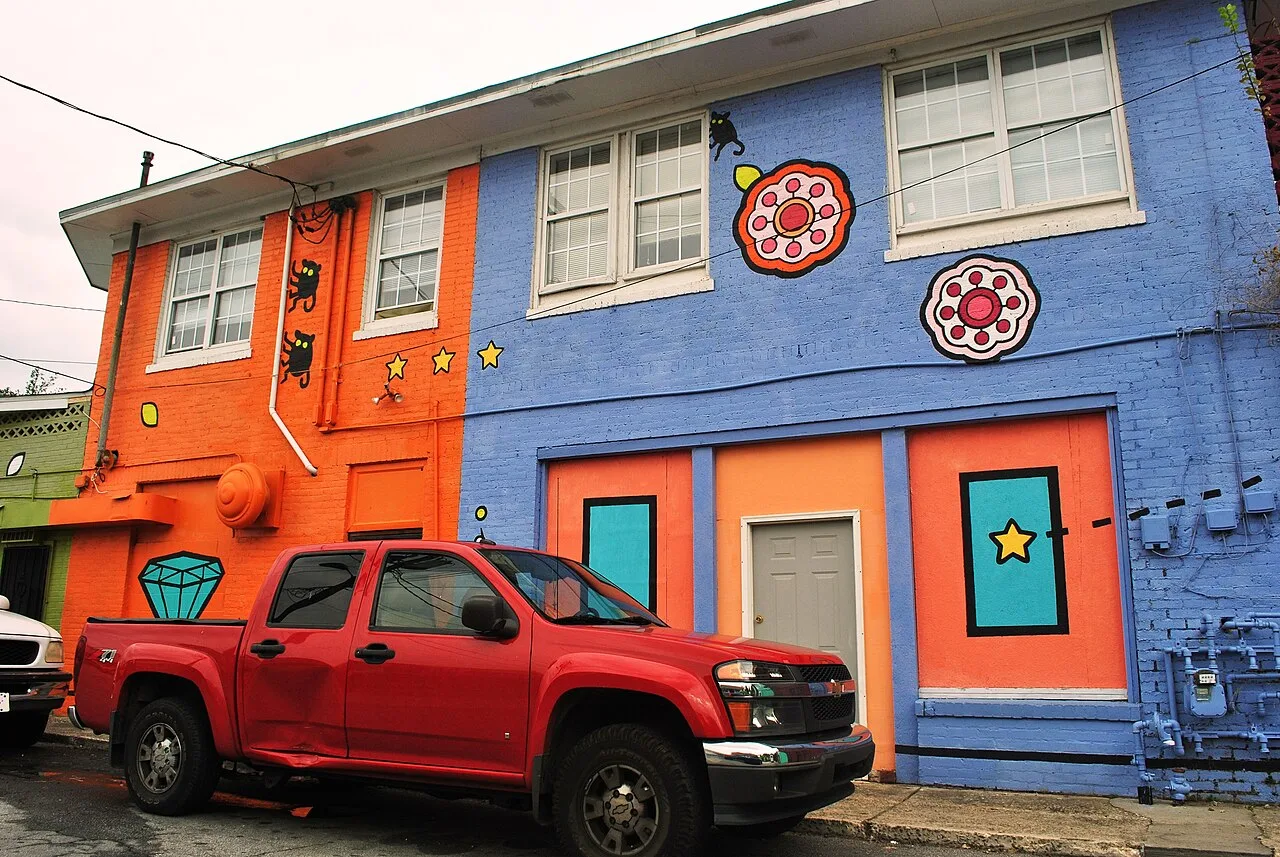 Painted storefronts in the Lakewood Heights Historic District, the neighborhood around the former school. The picture does not show the school building.