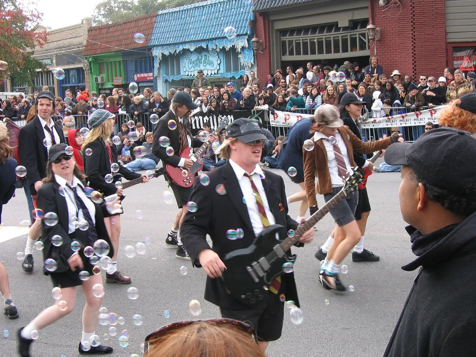 Costumed marchers with toy guitars in the Little Five Points Halloween parade in Atlanta